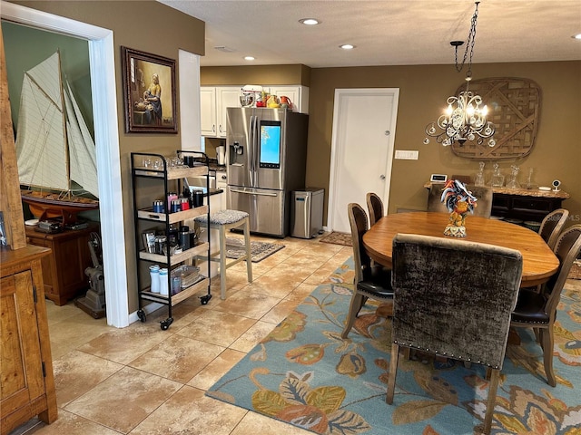 dining area featuring light tile patterned floors, a chandelier, and recessed lighting