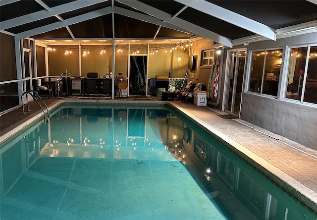 view of swimming pool featuring a swimming pool, a lanai, and a patio