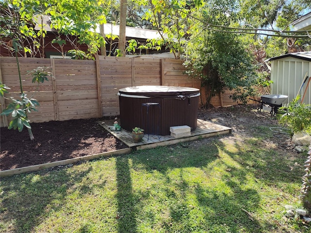 view of yard featuring cooling unit and a hot tub