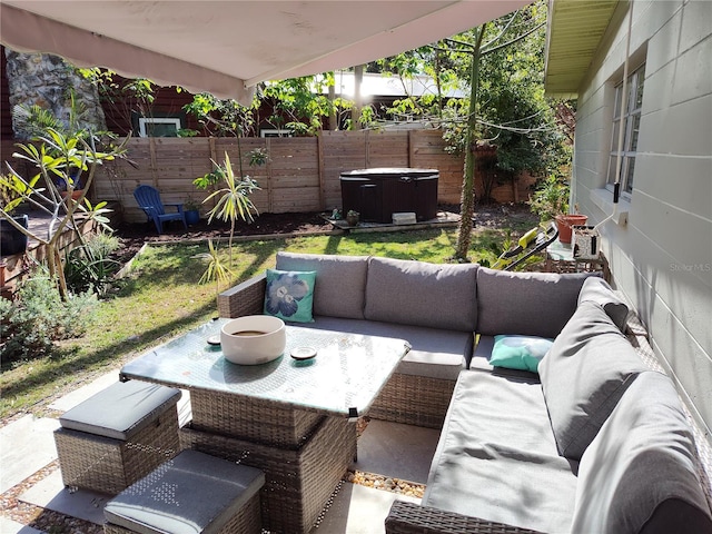 view of patio featuring outdoor lounge area and a hot tub