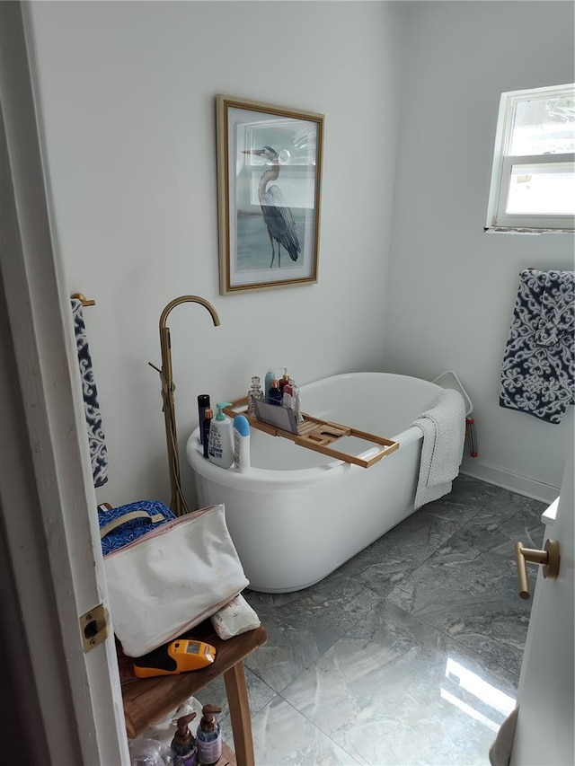 bathroom featuring a tub to relax in