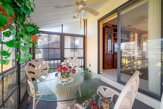 sunroom / solarium featuring vaulted ceiling and ceiling fan