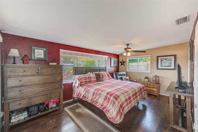 bedroom with ceiling fan and dark hardwood / wood-style flooring