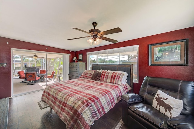 bedroom with access to exterior, ceiling fan, wood-type flooring, and vaulted ceiling