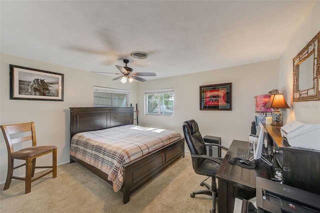 bedroom featuring light carpet and ceiling fan