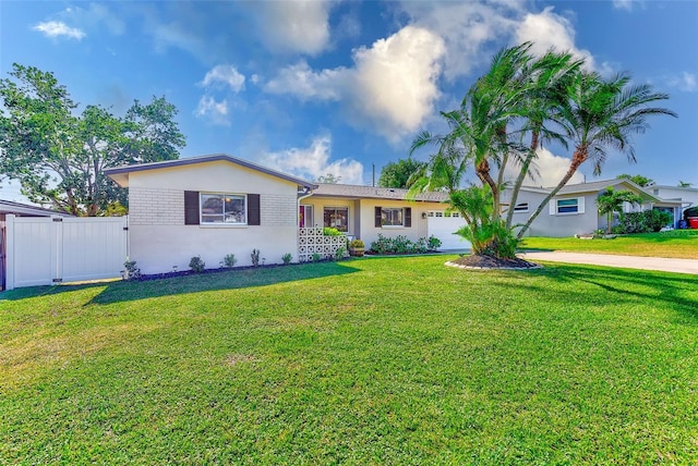 ranch-style home with a garage and a front lawn