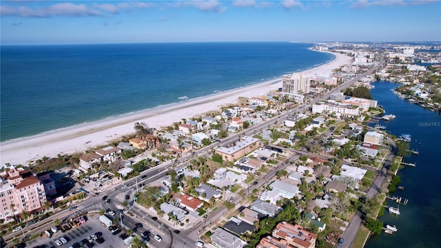 bird's eye view with a water view and a view of the beach