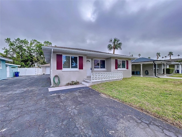 3505 Casablanca Ave, St Pete Beach, FL 33706 - view of front of property with a front yard and stucco siding