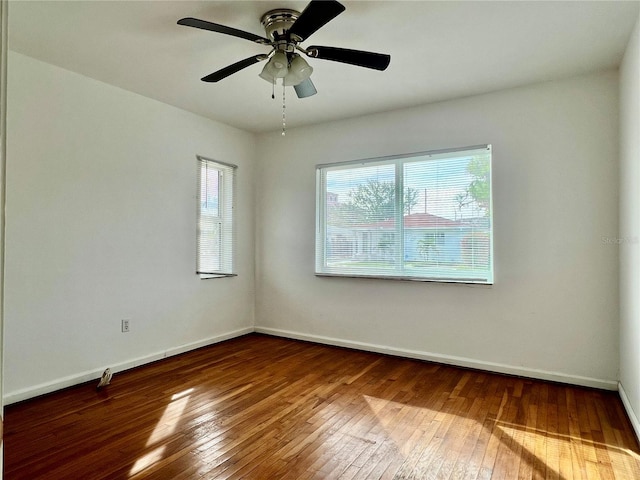 unfurnished room with hardwood / wood-style flooring and ceiling fan