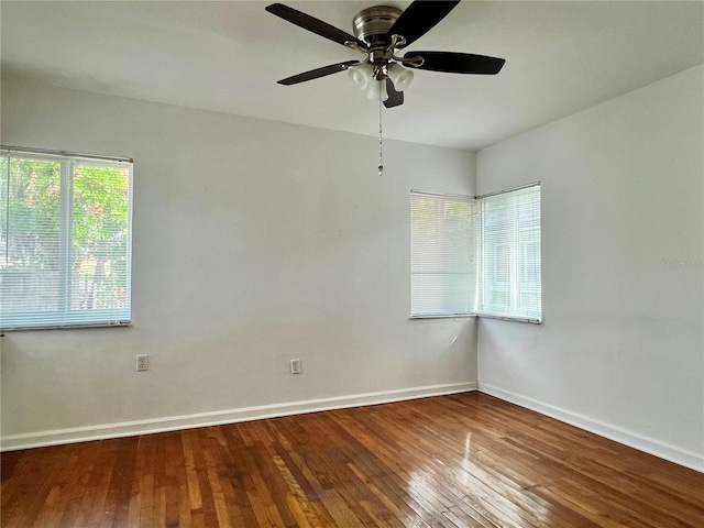 3505 Casablanca Ave, St Pete Beach, FL 33706 - unfurnished room with baseboards, hardwood / wood-style floors, and ceiling fan