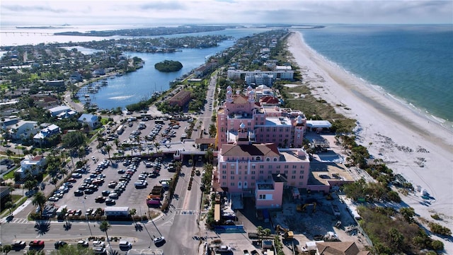 drone / aerial view featuring a view of the beach and a water view