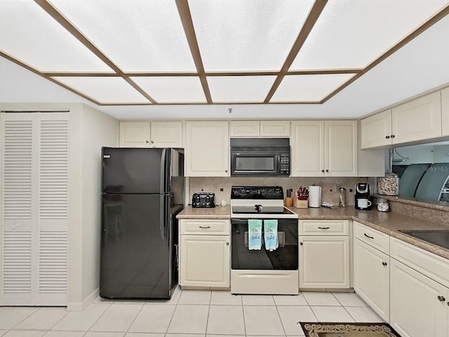 kitchen featuring black appliances, light tile patterned floors, backsplash, and cream cabinetry