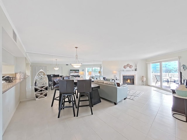 tiled dining room with ornamental molding