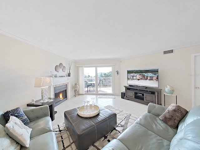 living room with crown molding and light tile patterned floors