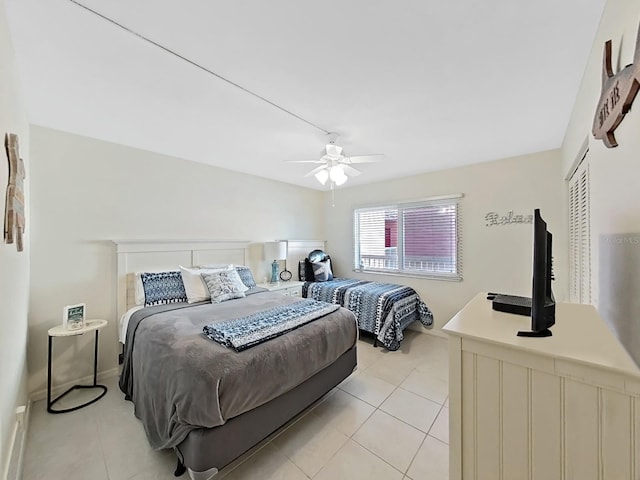 tiled bedroom with a closet and ceiling fan