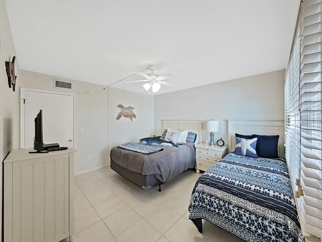 bedroom with ceiling fan and light tile patterned flooring