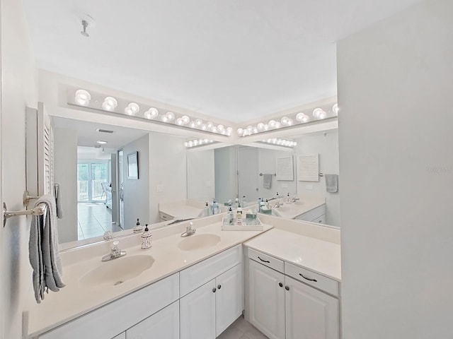 bathroom featuring tile patterned floors and vanity