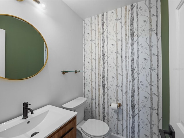 bathroom with vanity and toilet