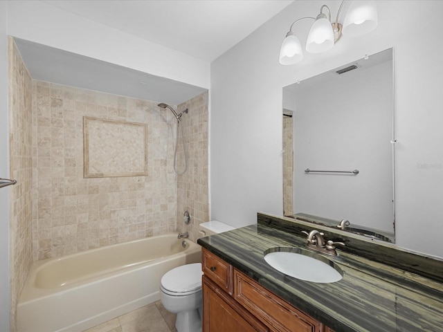 full bathroom with tile patterned flooring, vanity, toilet, and tiled shower / bath