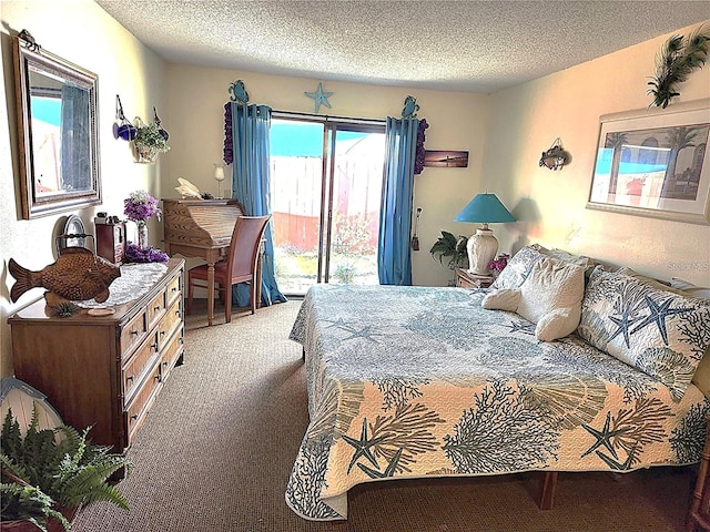 carpeted bedroom featuring access to exterior and a textured ceiling