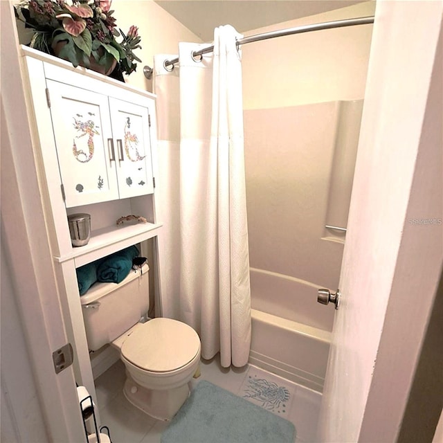 bathroom with tile patterned floors, toilet, and shower / bath combo