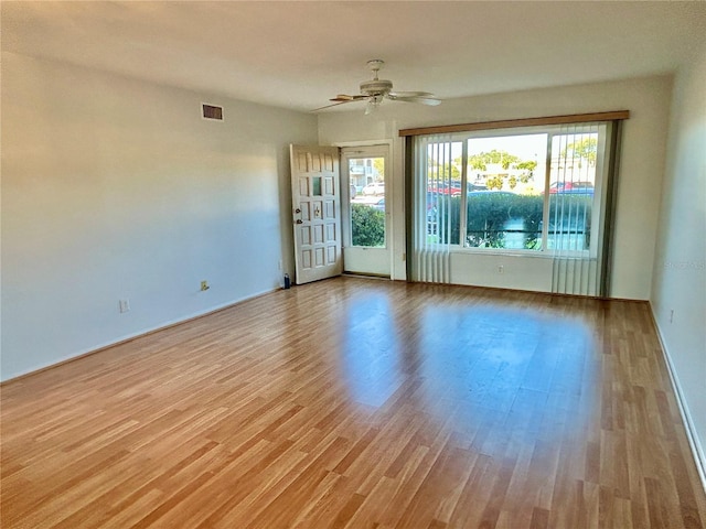 empty room featuring light hardwood / wood-style floors and ceiling fan