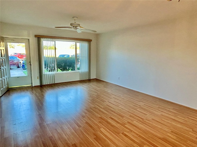 unfurnished room with ceiling fan and light hardwood / wood-style flooring