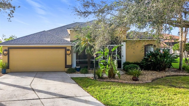 2915 126th Ter E, Parrish, FL 34219 - obstructed view of property with stucco siding, an attached garage, roof with shingles, and concrete driveway