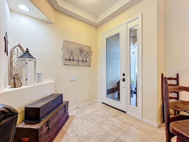 entryway with light tile patterned floors