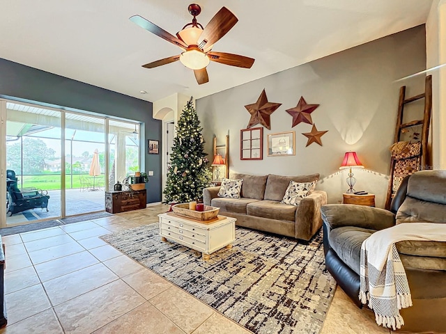 living room featuring ceiling fan and light tile patterned floors