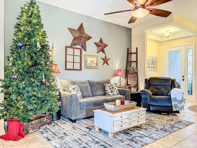 tiled living room with ceiling fan