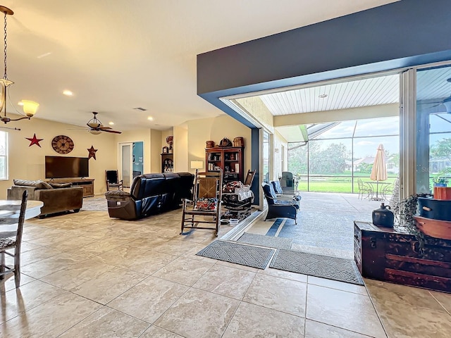 living room featuring plenty of natural light and ceiling fan