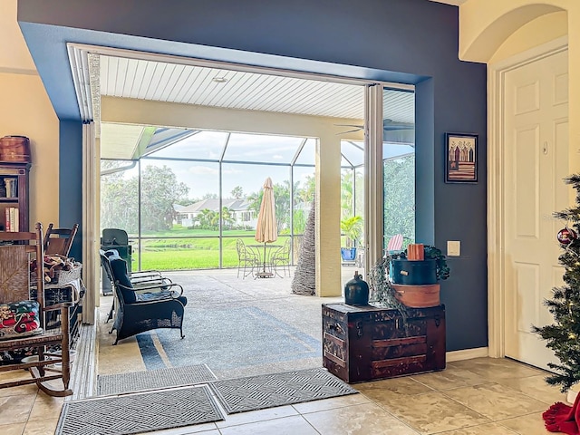 doorway with light tile patterned flooring