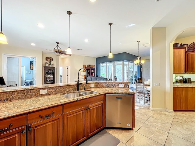 2915 126th Ter E, Parrish, FL 34219 - kitchen featuring a sink, dishwasher, brown cabinets, a ceiling fan, and open floor plan