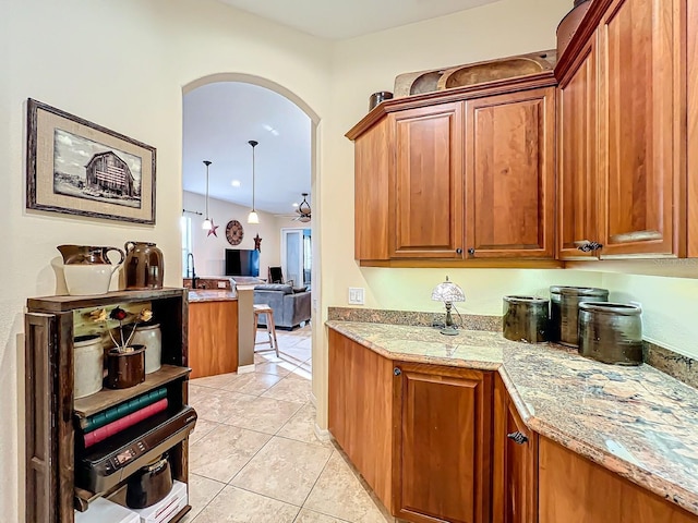 kitchen featuring light tile patterned flooring and pendant lighting