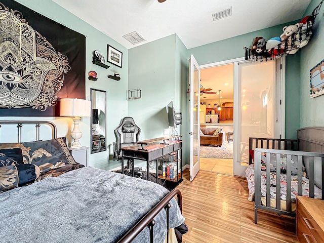 bedroom with light wood-type flooring