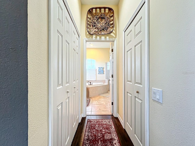 2915 126th Ter E, Parrish, FL 34219 - corridor with a textured wall and dark wood-type flooring