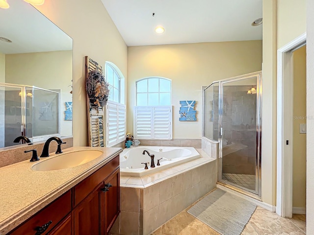 bathroom featuring vanity and plus walk in shower