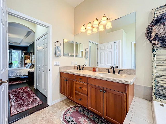 bathroom featuring tile patterned flooring and vanity