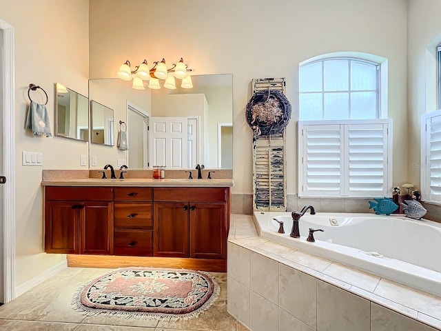 bathroom with tiled bath and vanity