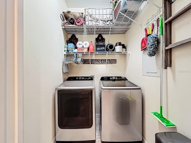 laundry room featuring separate washer and dryer