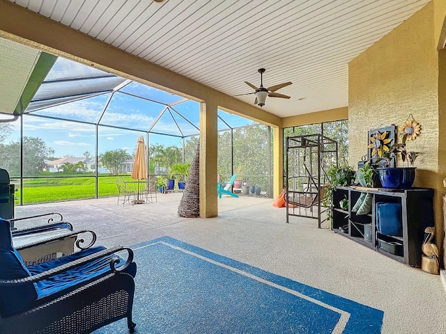 view of patio with a lanai and ceiling fan