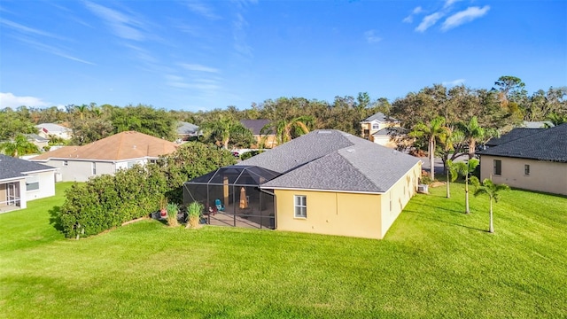2915 126th Ter E, Parrish, FL 34219 - back of property featuring a yard, a residential view, a lanai, and stucco siding