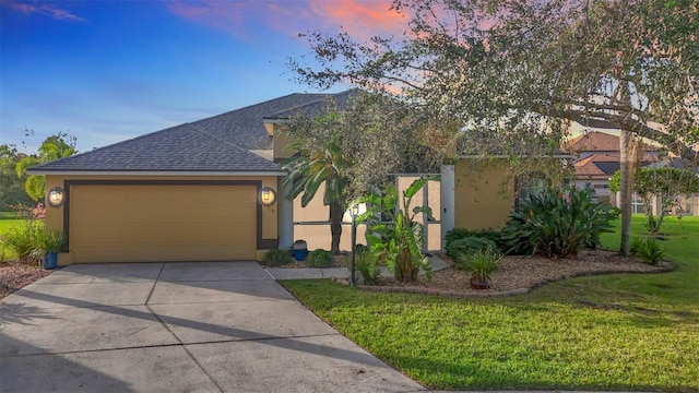 2915 126th Ter E, Parrish, FL 34219 - obstructed view of property featuring stucco siding, a shingled roof, driveway, a garage, and a lawn