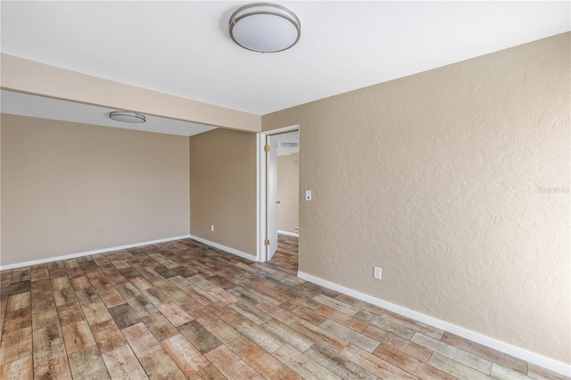 empty room featuring hardwood / wood-style floors