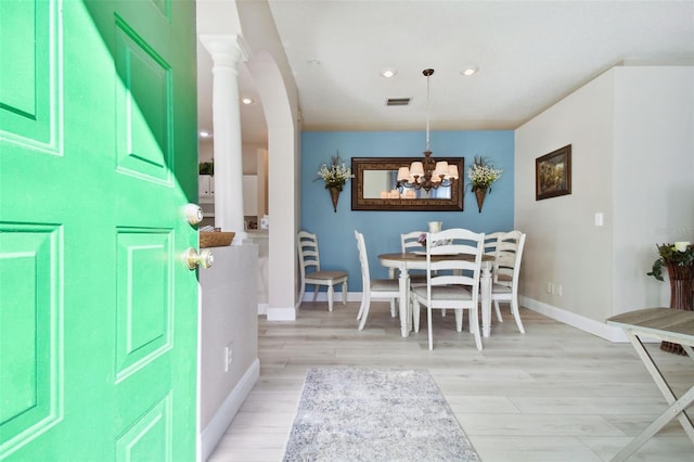 1687 Starling Dr, Tarpon Springs, FL 34689 - foyer entrance with baseboards, light wood-type flooring, recessed lighting, a chandelier, and arched walkways