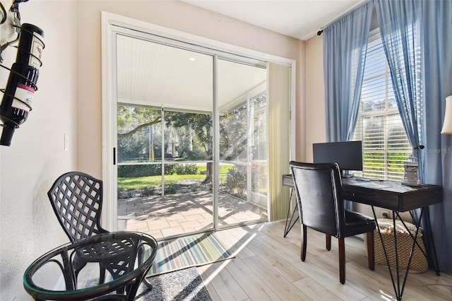 1687 Starling Dr, Tarpon Springs, FL 34689 - office area with healthy amount of natural light and light wood-type flooring