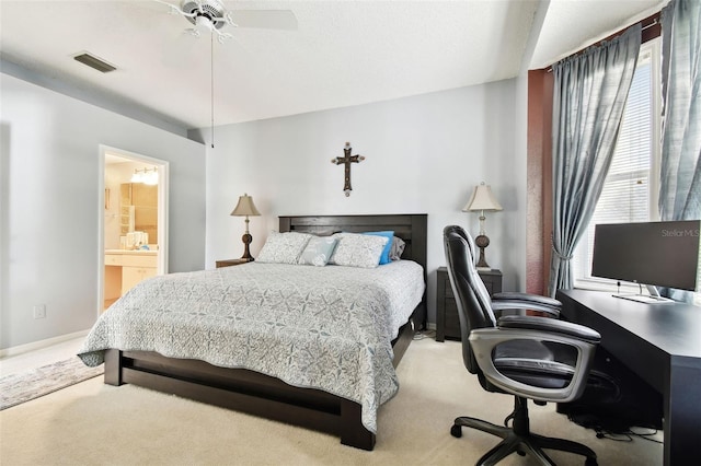 bedroom featuring carpet, connected bathroom, and ceiling fan