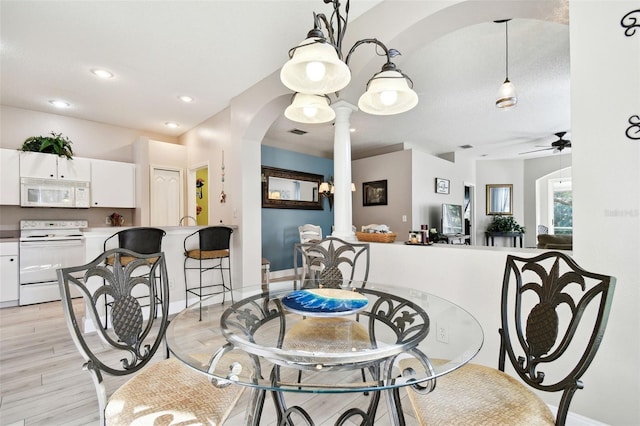 1687 Starling Dr, Tarpon Springs, FL 34689 - dining area featuring decorative columns, light wood-style floors, ceiling fan, baseboards, and recessed lighting