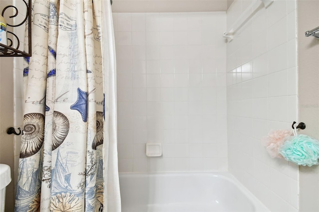 bathroom with shower / bath combination with curtain